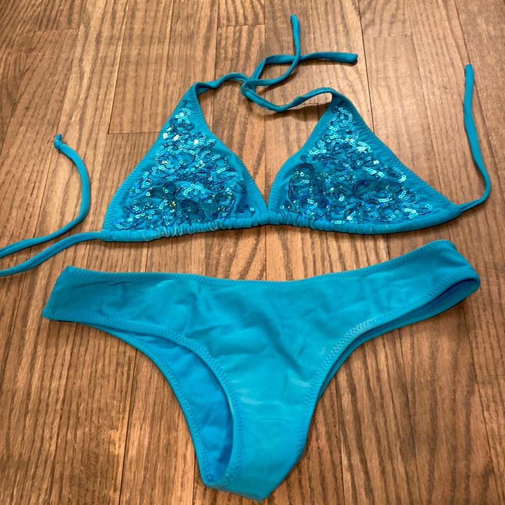Teal colored bathing suit. Large. Good condition